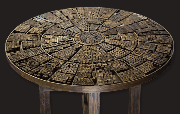 Image of Chinese characters on top of a circular wooden platform.