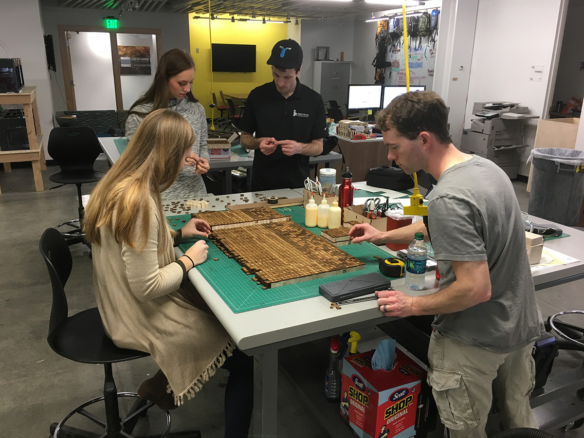 Students and staff at the iHub working on the Song Dynasty English printing table.